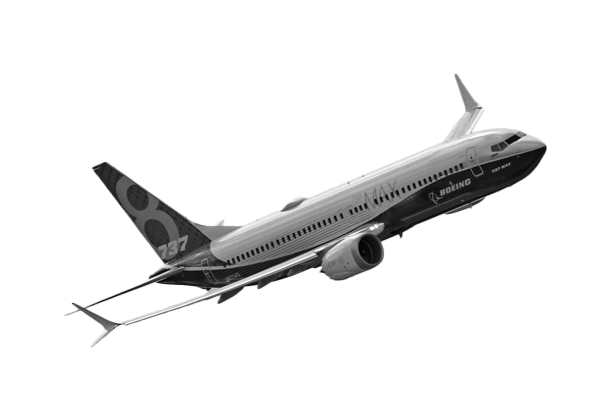 A black and white image of a Boeing 737 aircraft, making a right turn mid-flight.