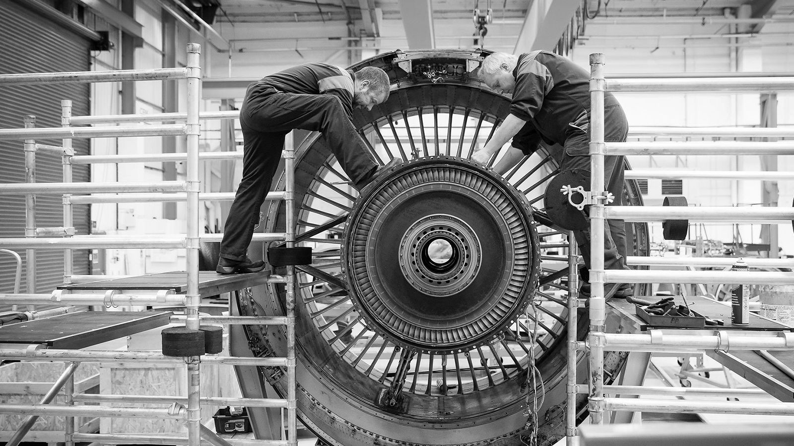 Aerfin employees working on an engine